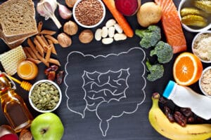 Chalk drawing of gut with healthy foods