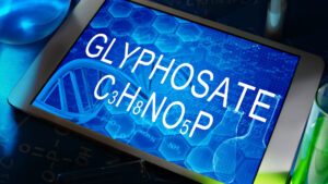 Tablet display showing glyphosate chemical formula C3H8NO5P
