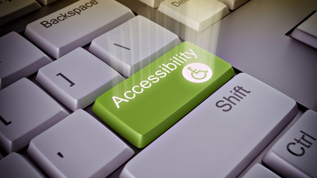 Keyboard with green accessibility key featuring wheelchair symbol