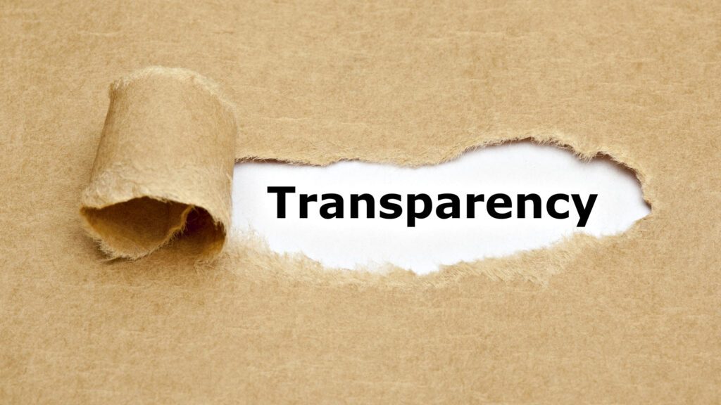 Ripped paper revealing the word transparency underneath