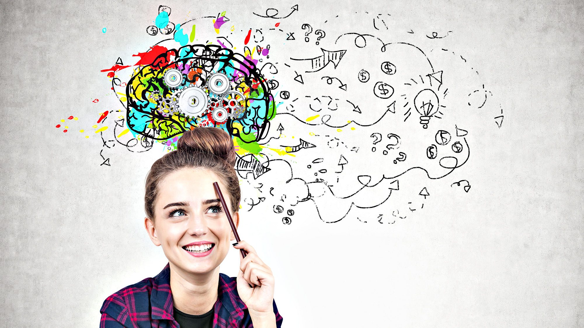 Creative woman visualizing ideas with colourful brain sketch